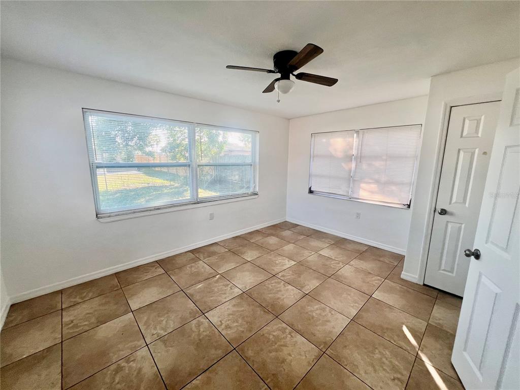 9504 Richwood Lane Port Richey, FL 34668 - Photo 11 of 16 a view of an empty room with a window
