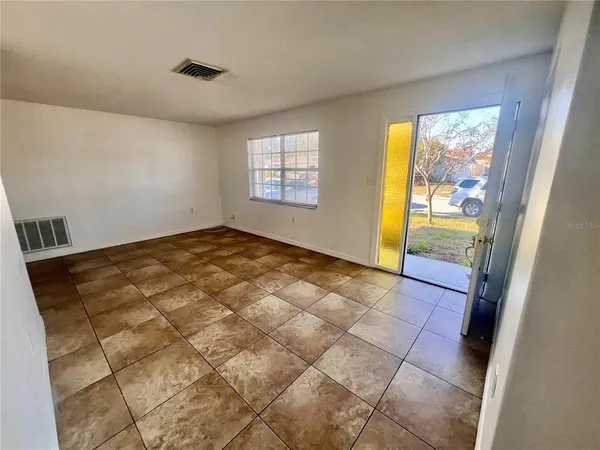 a view of an empty room and window