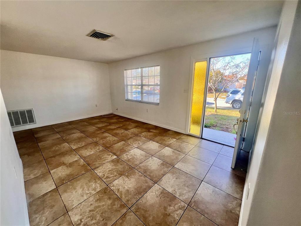 9504 Richwood Lane Port Richey, FL 34668 - Photo 4 of 16 a view of an empty room and window
