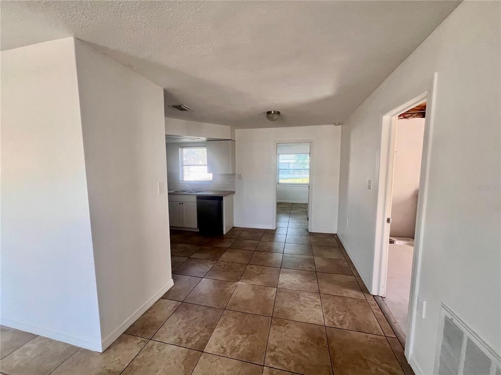 9504 Richwood Lane Port Richey, FL 34668 - Photo 7 of 16 a view of a hallway to rooms and stairs