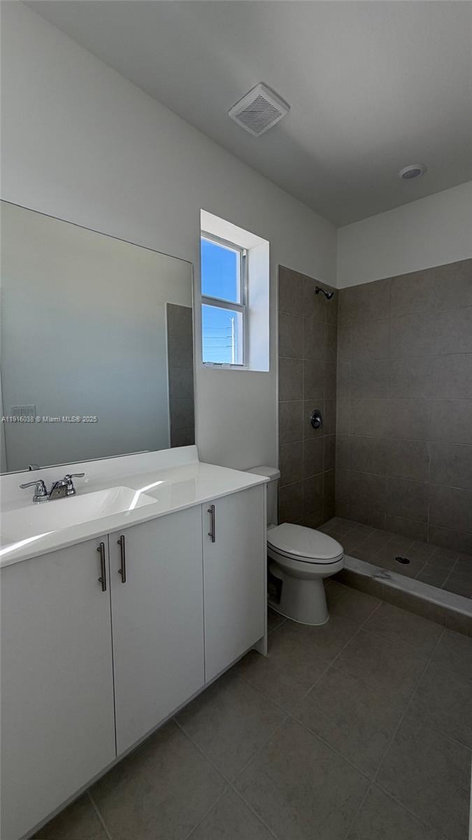 15624 Southwest 276th Terrace Homestead, FL 33031 - Photo 11 of 14 a bathroom with a sink and mirror