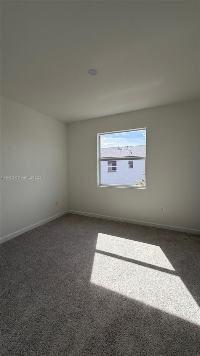 15624 Southwest 276th Terrace Homestead, FL 33031 - Photo 6 of 14 an empty room with a empty space and a window