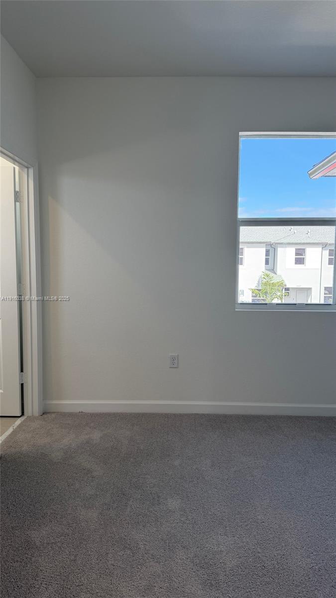 15624 Southwest 276th Terrace Homestead, FL 33031 - Photo 10 of 14 a view of an empty room with a window