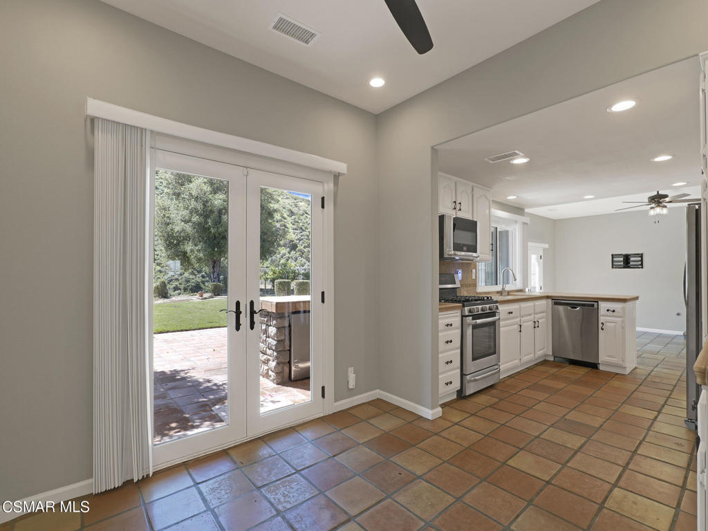 1590 Meander Drive Simi Valley, CA 93065 - Photo 20 of 57 a view of a kitchen with a sink and a refrigerator