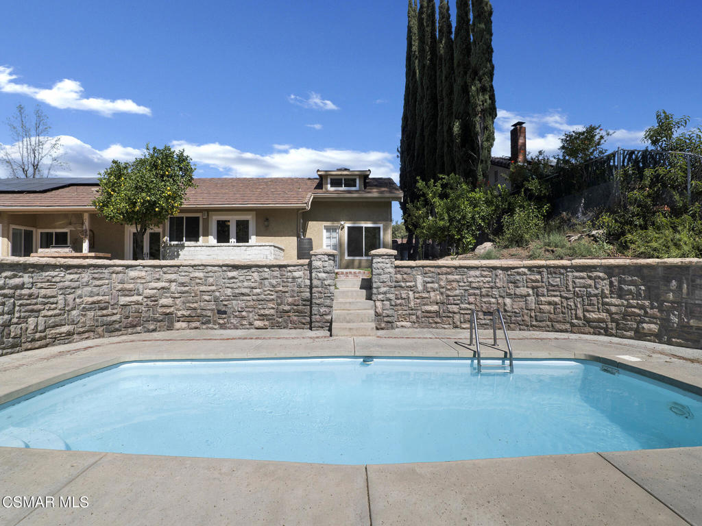 1590 Meander Drive Simi Valley, CA 93065 - Photo 43 of 57 a front view of a house with a yard