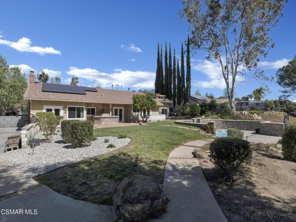 1590 Meander Drive Simi Valley, CA 93065 - Photo 48 of 57 a front view of a house with garden and plants