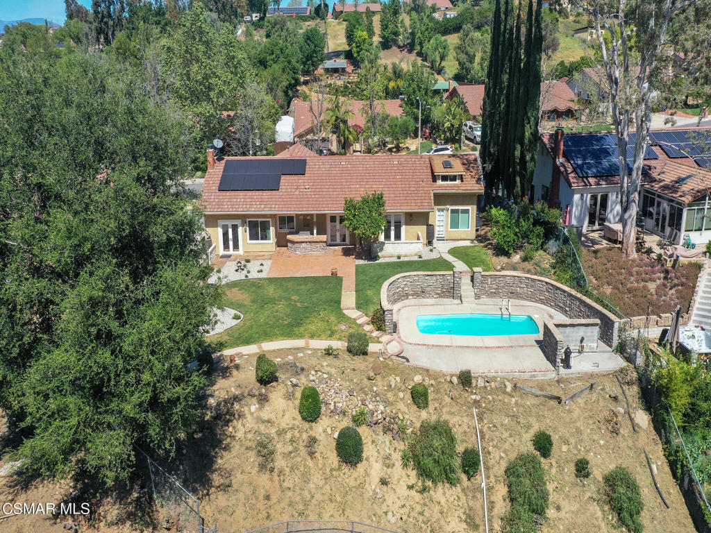 1590 Meander Drive Simi Valley, CA 93065 - Photo 53 of 57 an aerial view of a house with swimming pool and large trees