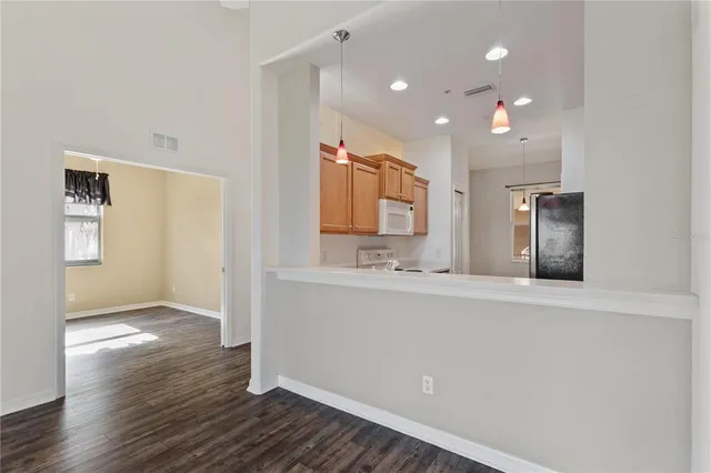 a living room with furniture dining table and a large window