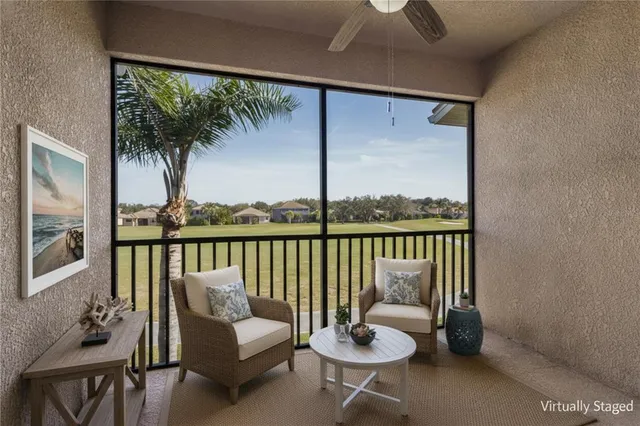 a view of a balcony with wooden floor and fence