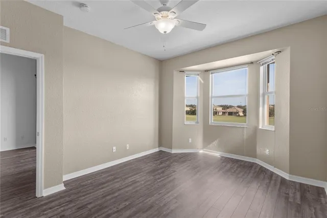 a bathroom with a glass door shower and a toilet