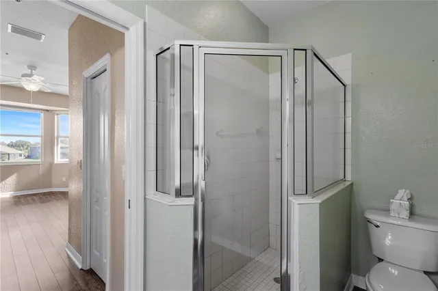 a view of an empty room and wooden floor