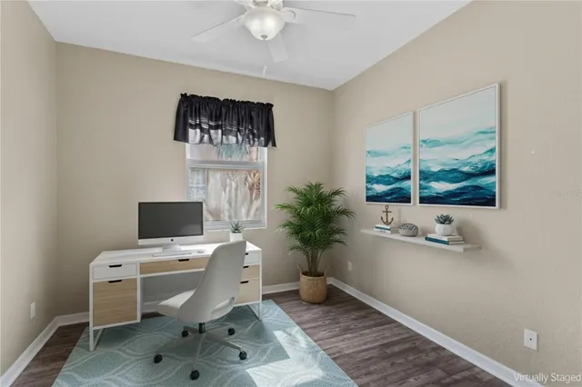 a bedroom with a bed and a potted plant