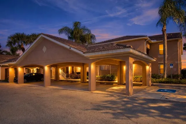 a kitchen with stainless steel appliances granite countertop a sink and a stove top oven