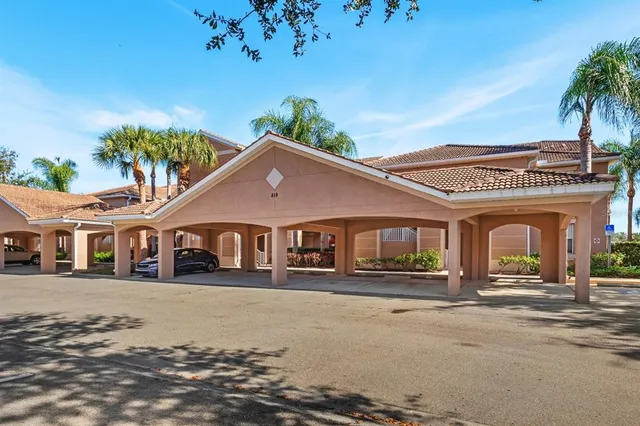 a aerial view of a house with a yard and potted plants