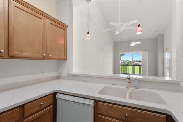 a room that has a chandelier and a rug