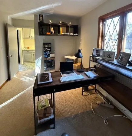 a view of a workspace with furniture