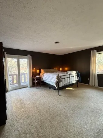 a room with a bed and a window