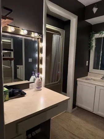 a kitchen with a sink and cabinets