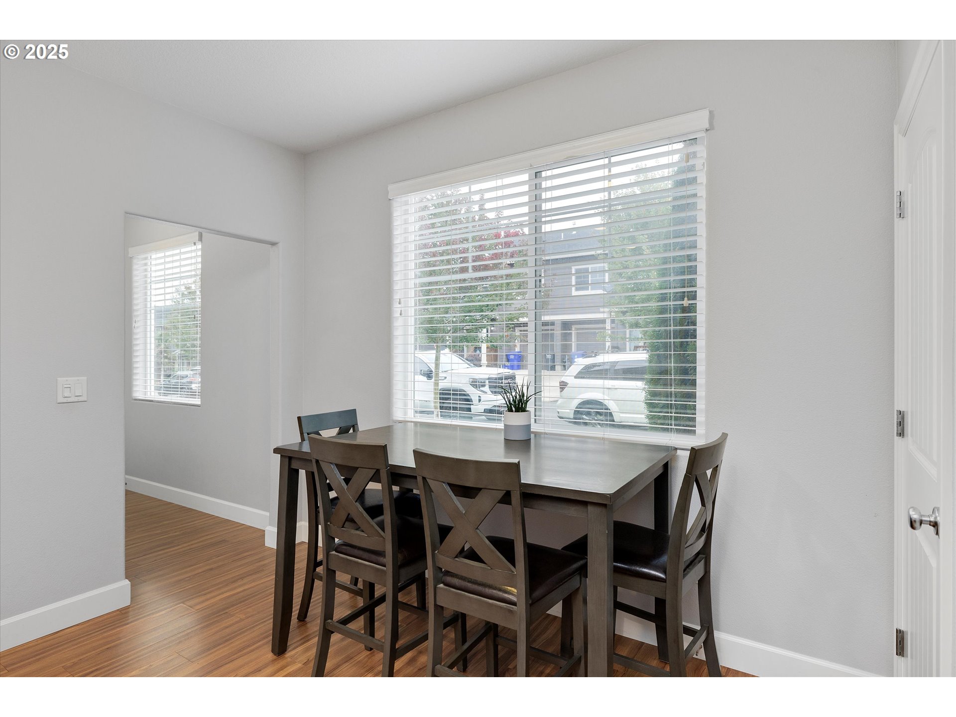 19003 Southeast Village Boulevard Sandy, OR 97055 - Photo 14 of 34 a view of a dining room with furniture and wooden floor