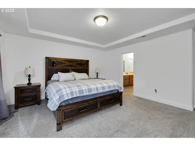 a bedroom with a bed and furniture