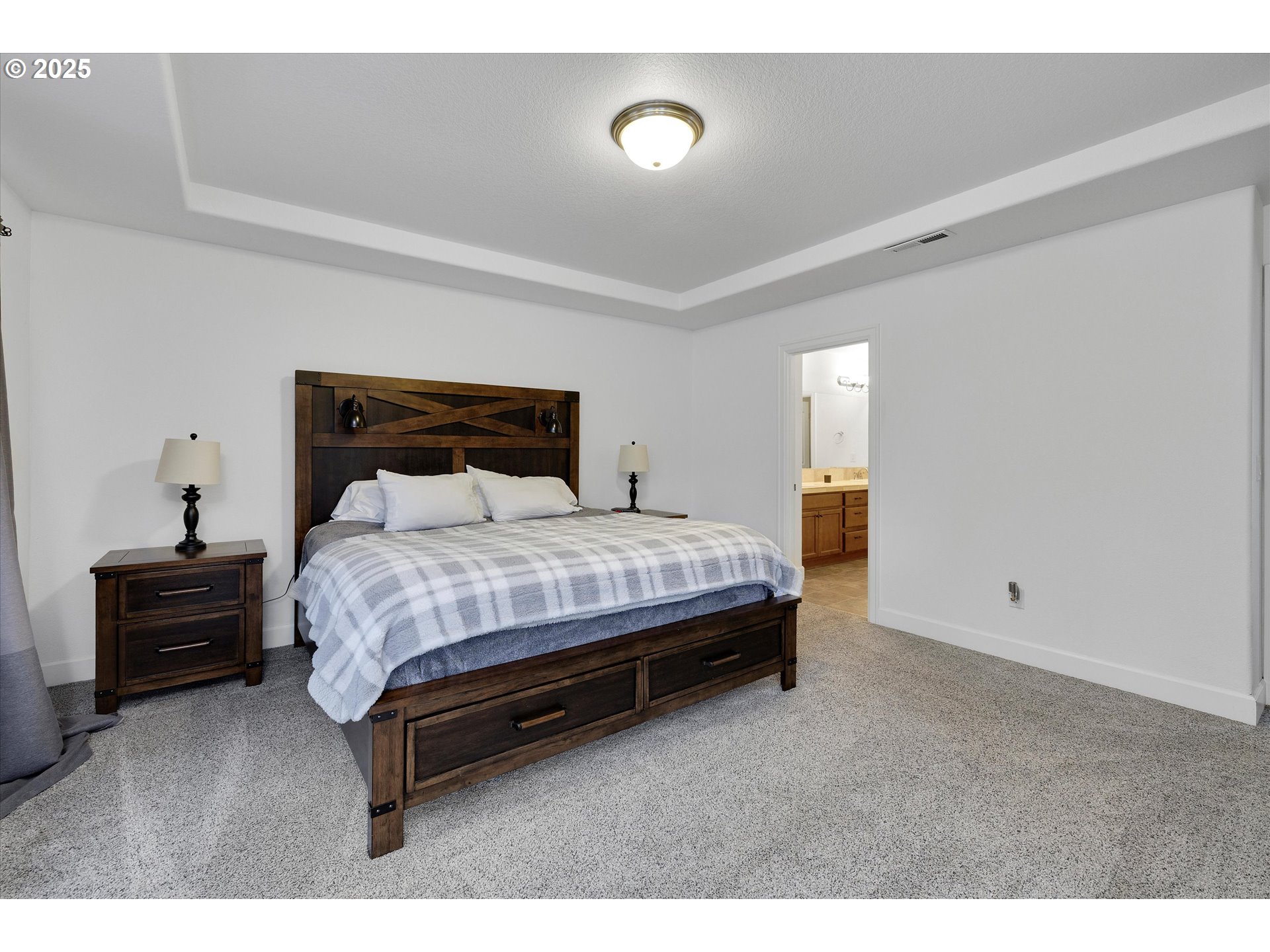 19003 Southeast Village Boulevard Sandy, OR 97055 - Photo 18 of 34 a bedroom with a bed and furniture