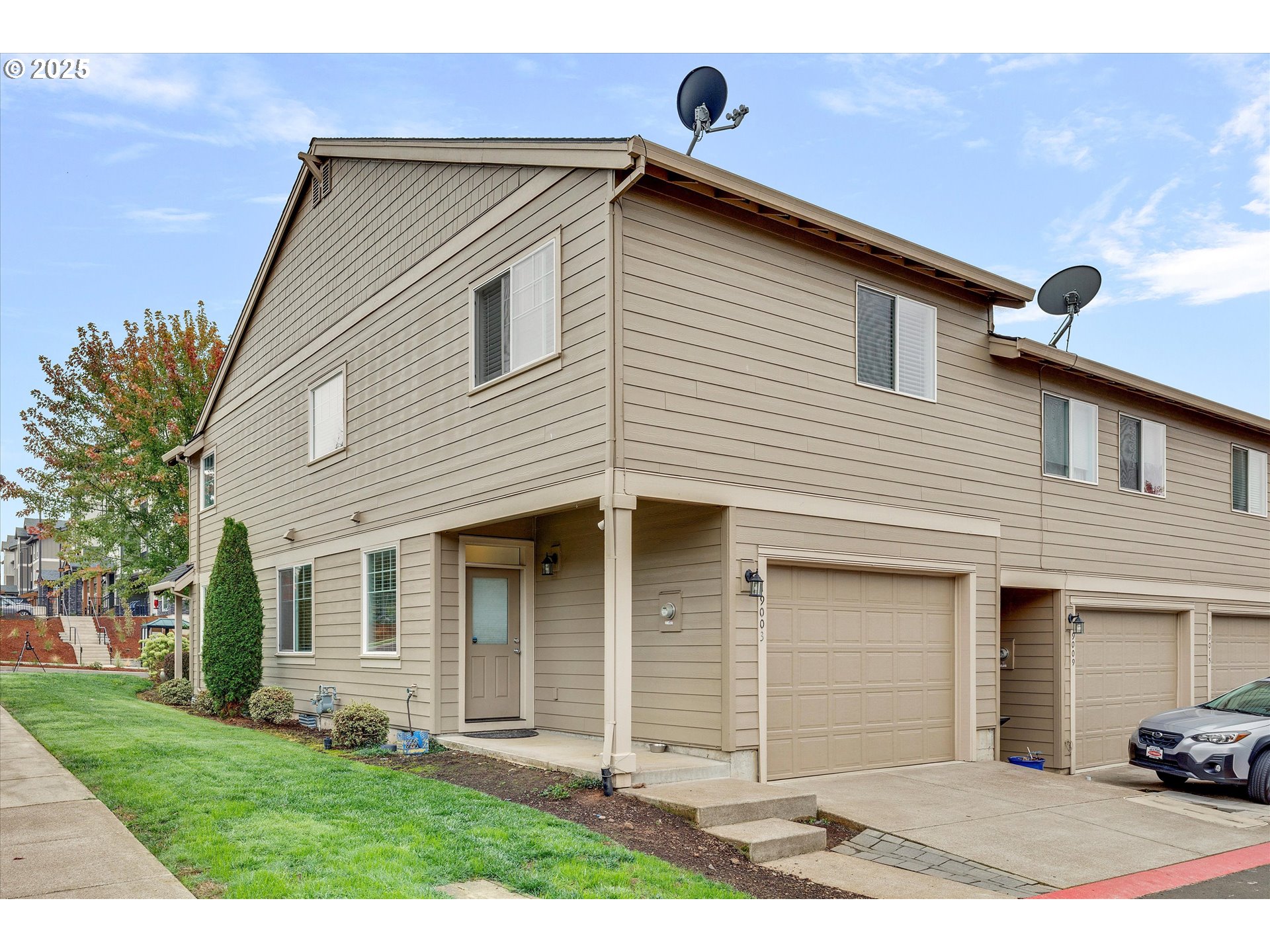 19003 Southeast Village Boulevard Sandy, OR 97055 - Photo 27 of 34 a front view of a house with a yard