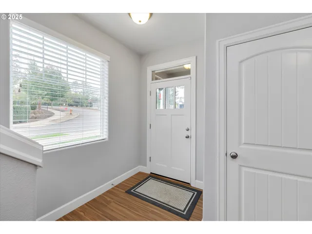 a view of an empty room and a window