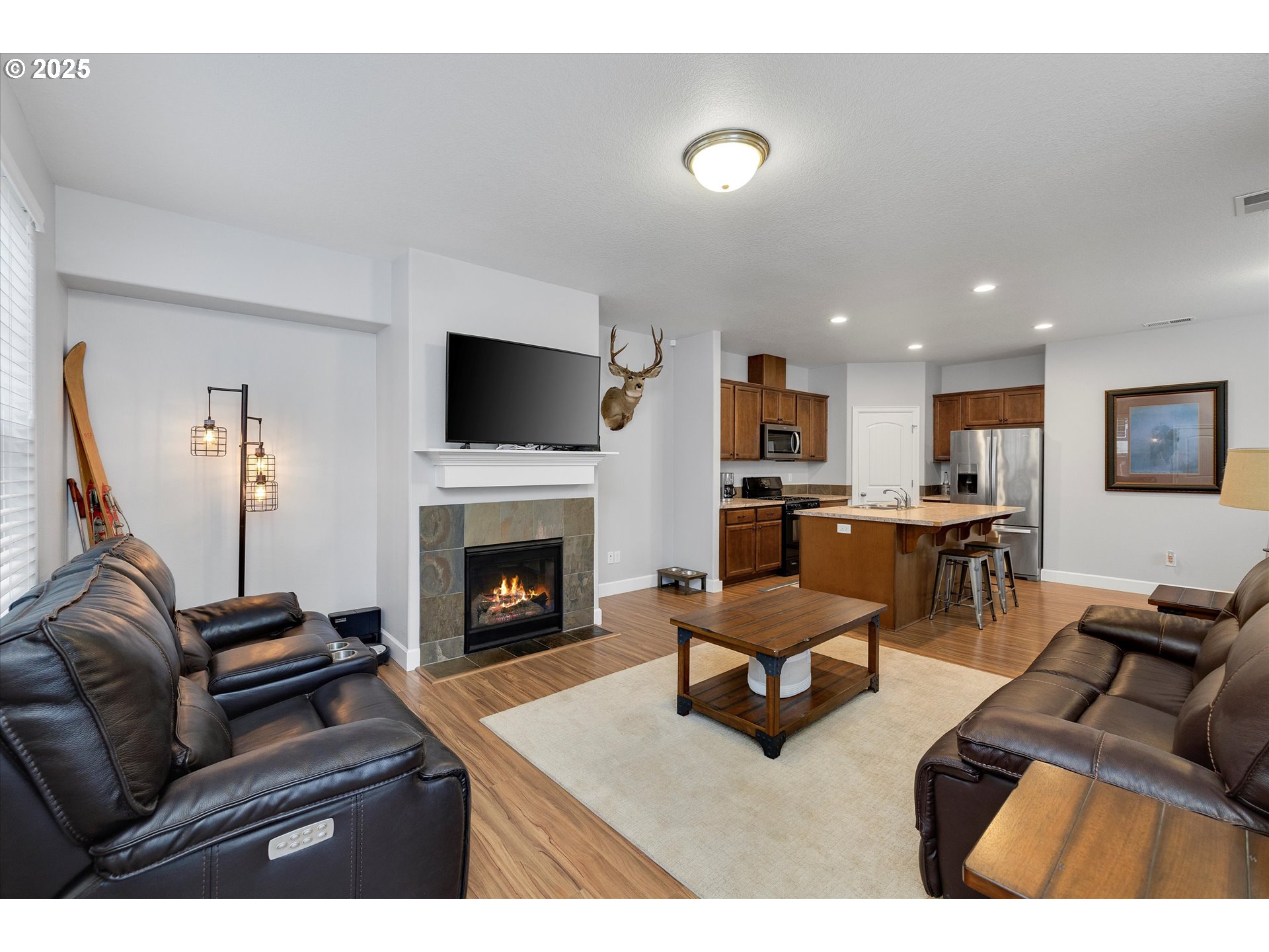 19003 Southeast Village Boulevard Sandy, OR 97055 - Photo 4 of 34 a living room with furniture and a fireplace