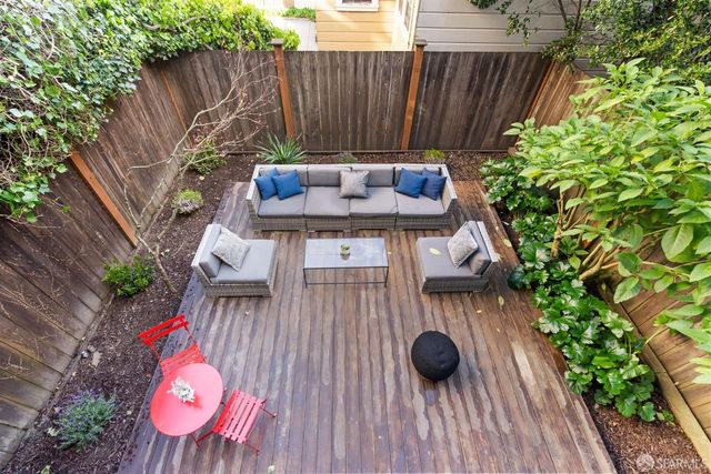 a view of a deck with furniture