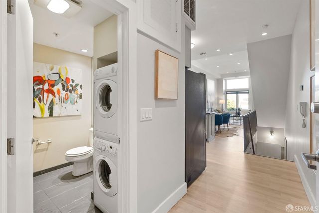 a bathroom with a toilet sink and shower