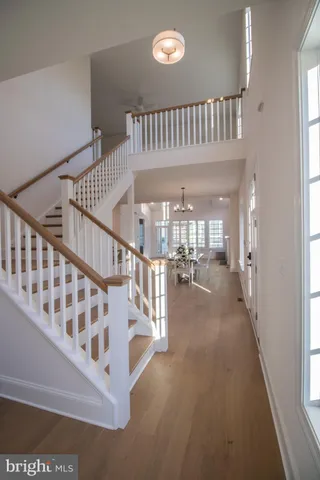 a view of entryway livingroom and hall with wooden floor