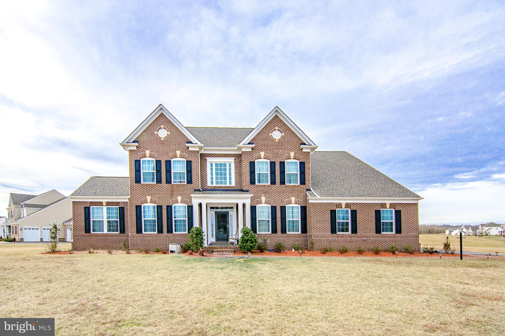 Elegant  exterior and  private one-acre homesite