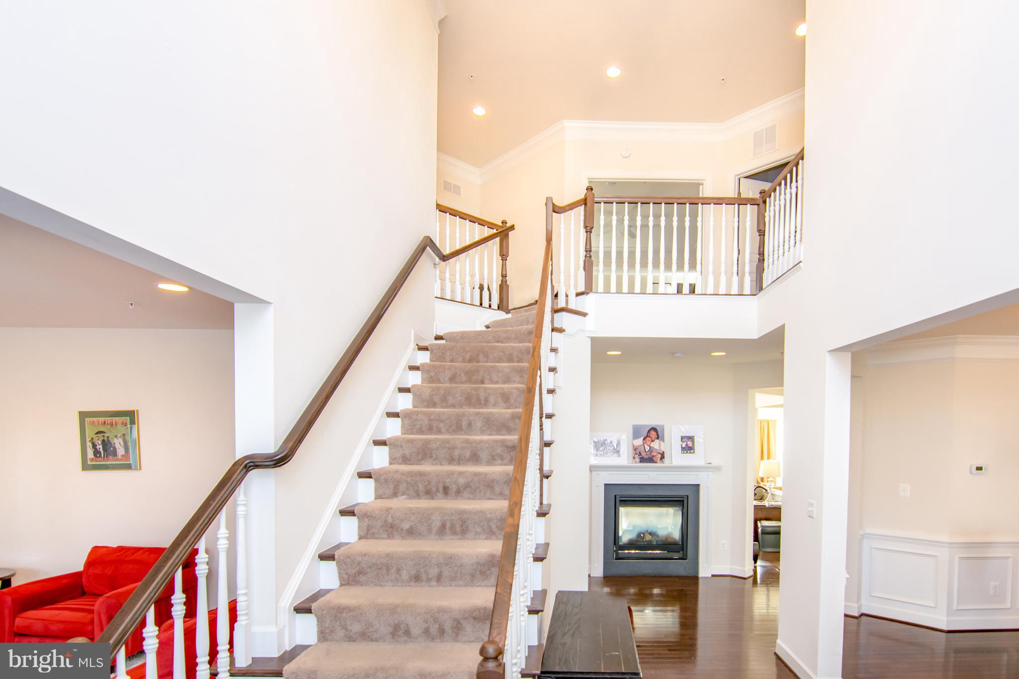 Open Foyer with Dual Sided Fireplace