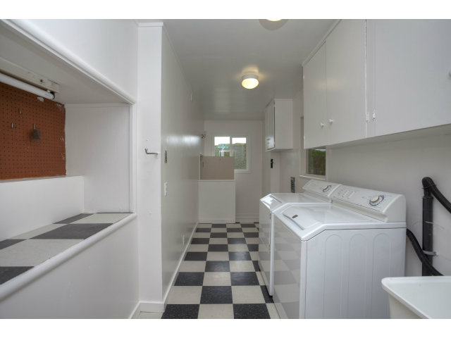 240 Victoria Road Burlingame, CA 94010 - Photo 11 of 13 a hallway with a washer and dryer