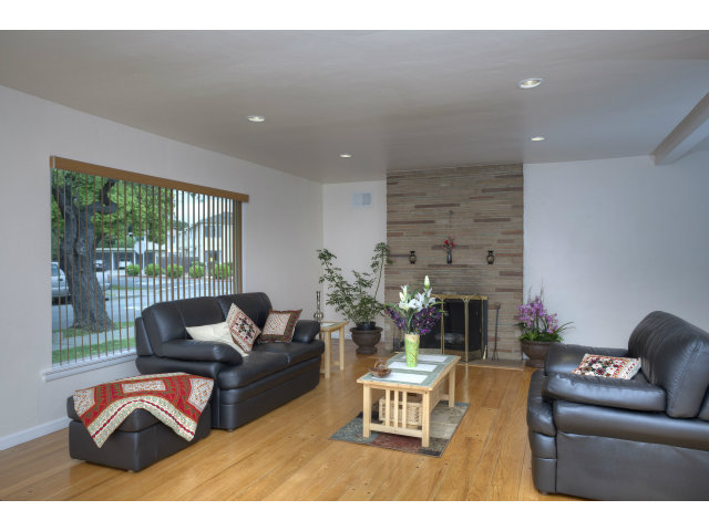 240 Victoria Road Burlingame, CA 94010 - Photo 3 of 13 a living room with furniture lamp and a large window