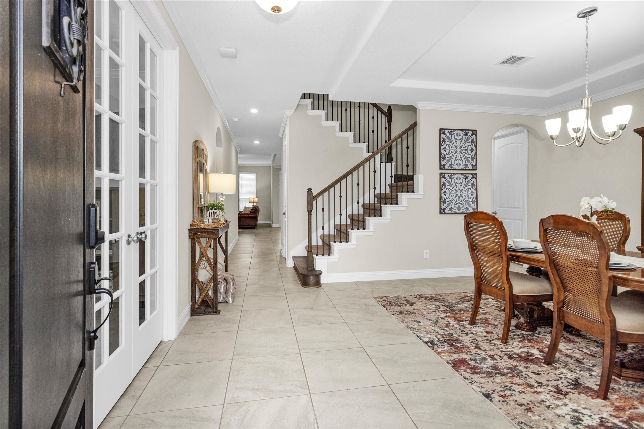 3622 Lister Drive Rosharon, TX 77583 - Photo 5 of 49 Imagine yourself walking into this view after a long day! To the left here are the double french doors to your new office/study, to the right is the formal dining room, then a hallway to your in house laundry room then kitchen. Walking straight ahead you will enter your new kitchen and living room.