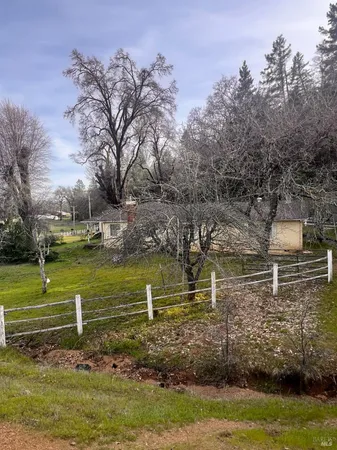 a view of a lake with a building in the background