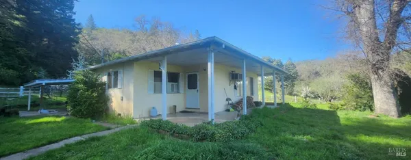 a view of a house with a yard