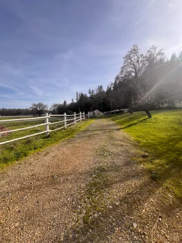 a view of a swimming pool and an outdoor seating