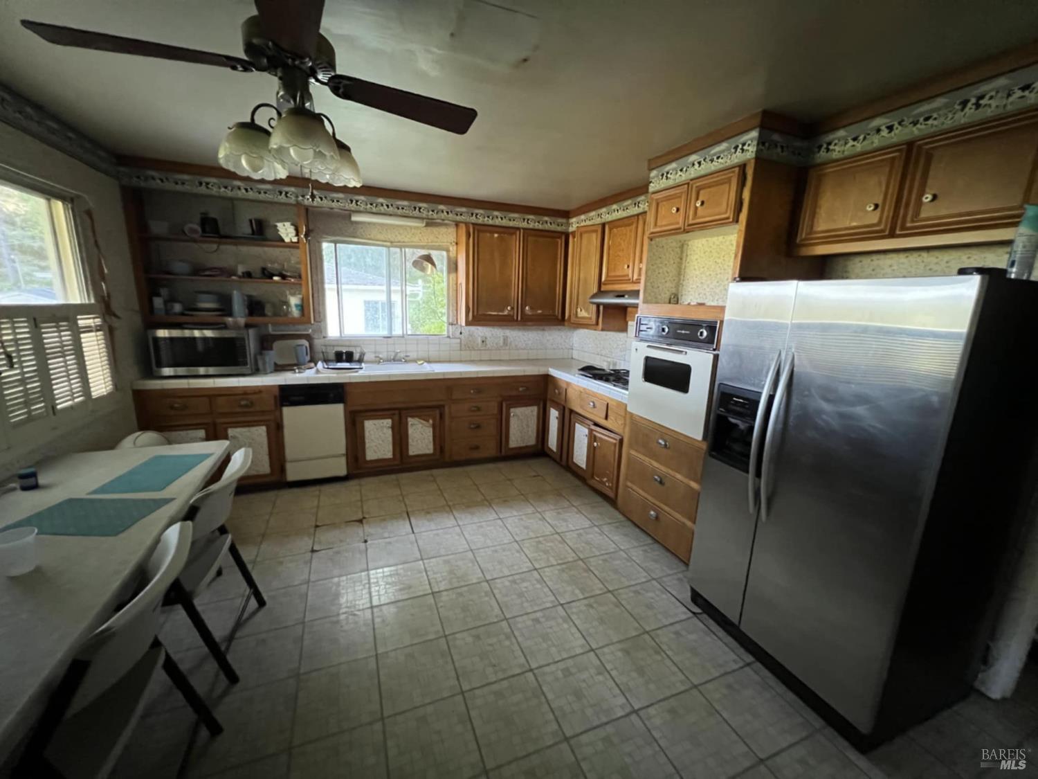 78951 Zenia Road Covelo, CA 95428 - Photo 3 of 37 a kitchen with stainless steel appliances granite countertop a sink and a refrigerator