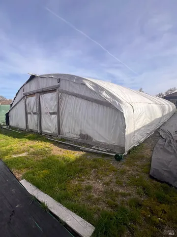 a view of a backyard with a small pool