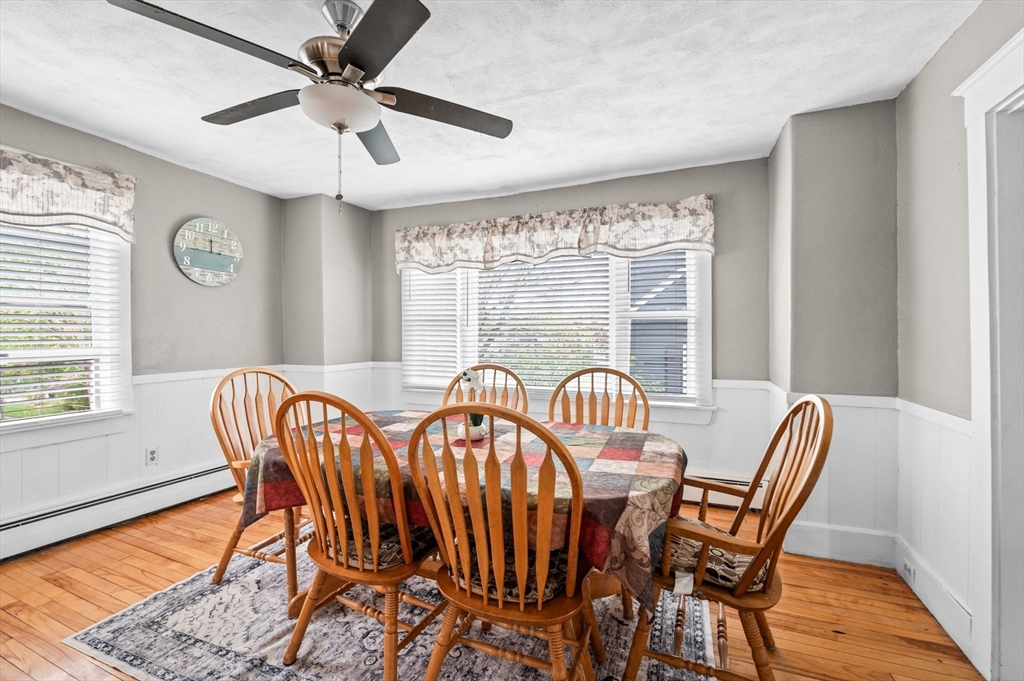 42 Chase Street Danvers, MA 01923 - Photo 11 of 37 a dining room with furniture a chandelier and wooden floor
