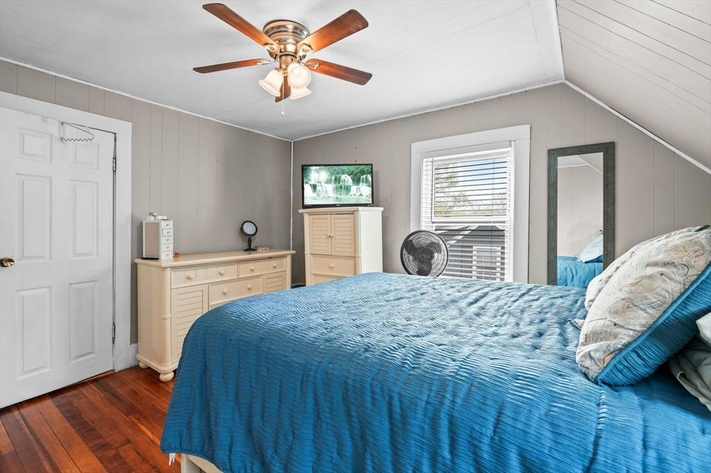 42 Chase Street Danvers, MA 01923 - Photo 16 of 37 a bedroom with a bed and a dresser with wooden floor