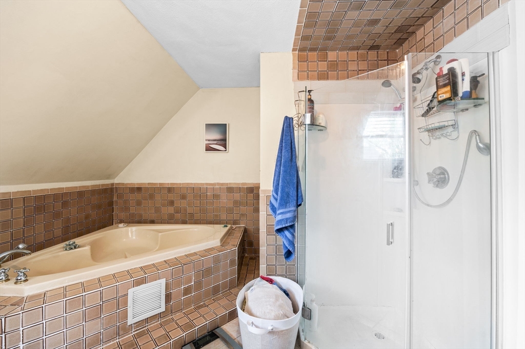 42 Chase Street Danvers, MA 01923 - Photo 21 of 37 a bathroom with a bathtub and toilet