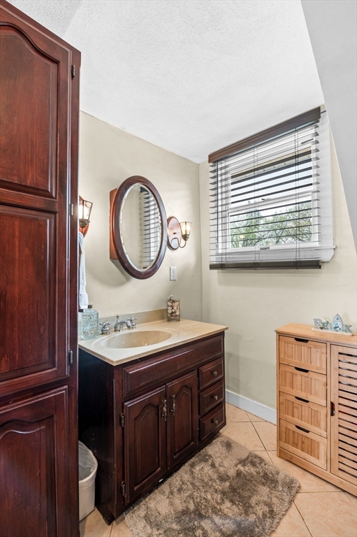 42 Chase Street Danvers, MA 01923 - Photo 22 of 37 a bathroom with a sink and a mirror