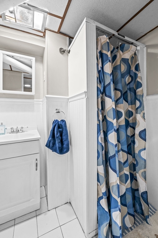 42 Chase Street Danvers, MA 01923 - Photo 25 of 37 a bathroom with a sink and a mirror