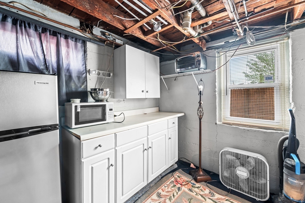 42 Chase Street Danvers, MA 01923 - Photo 28 of 37 a utility room with dryer and washer