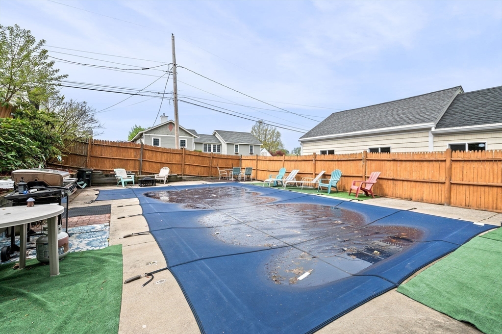 42 Chase Street Danvers, MA 01923 - Photo 31 of 37 a view of a swimming pool with a yard