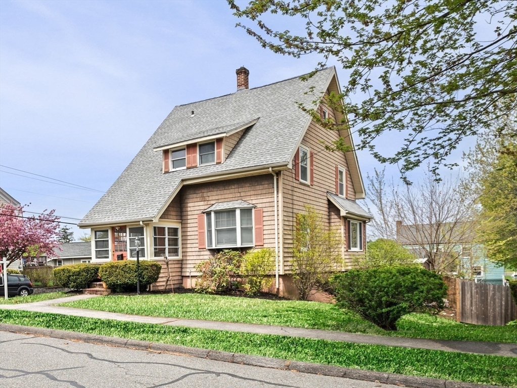 42 Chase Street Danvers, MA 01923 - Photo 32 of 37 a front view of a house with a garden