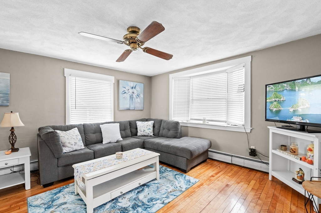 42 Chase Street Danvers, MA 01923 - Photo 5 of 37 a living room with furniture and a flat screen tv